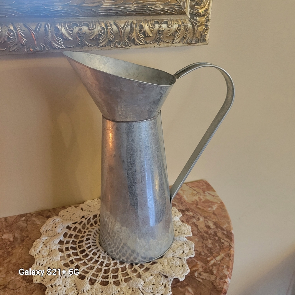 Vintage primitive metal pitcher